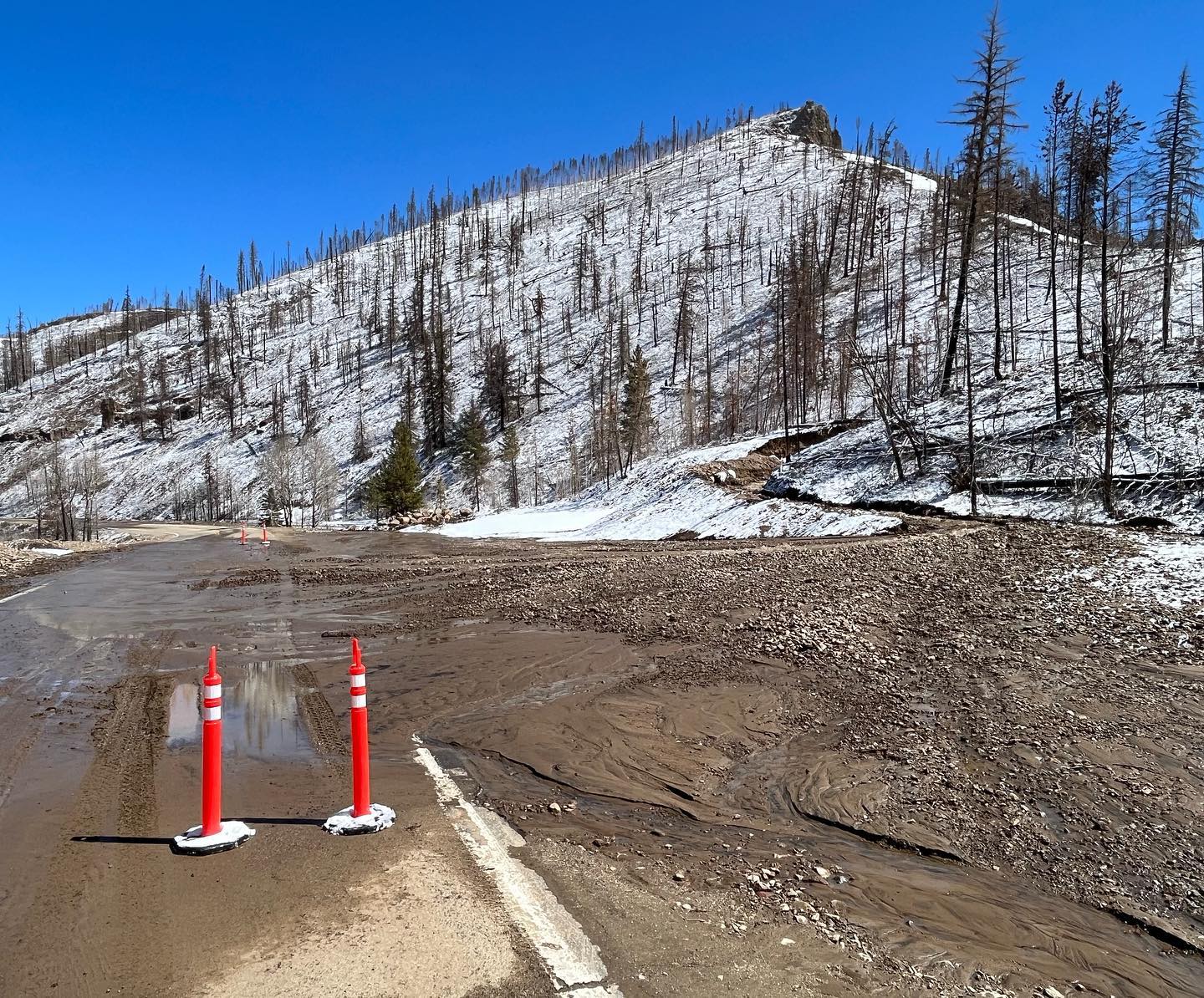 Mud covers a highway in the mountains