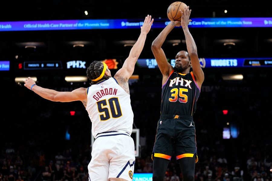 Phoenix Suns forward Kevin Durant (35) shoots over Denver Nuggets forward Aaron Gordon (50) during the first half of Game 4 of an NBA basketball Western Conference semifinal game, Sunday, May 7, 2023, in Phoenix. (AP Photo/Matt York)