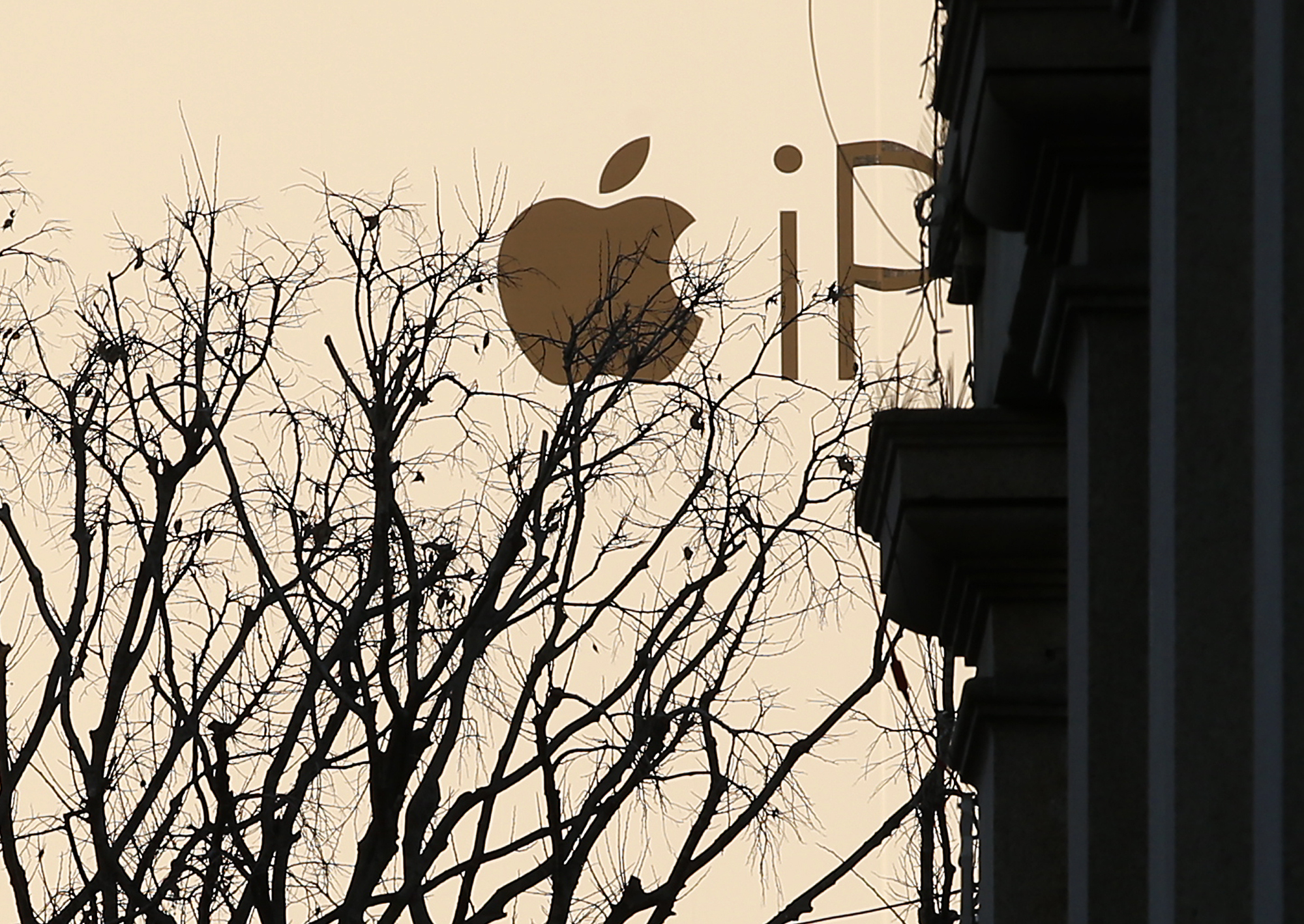 FILE - A huge publicity billboard is seen in downtown Milan, Italy, on Dec. 30, 2015. Italy’s anti-trust authority has opened an investigation into allegations that Apple is abusing its dominant position in the app market, officials said Thursday, May 11, 2023. (AP Photo/Antonio Calanni)