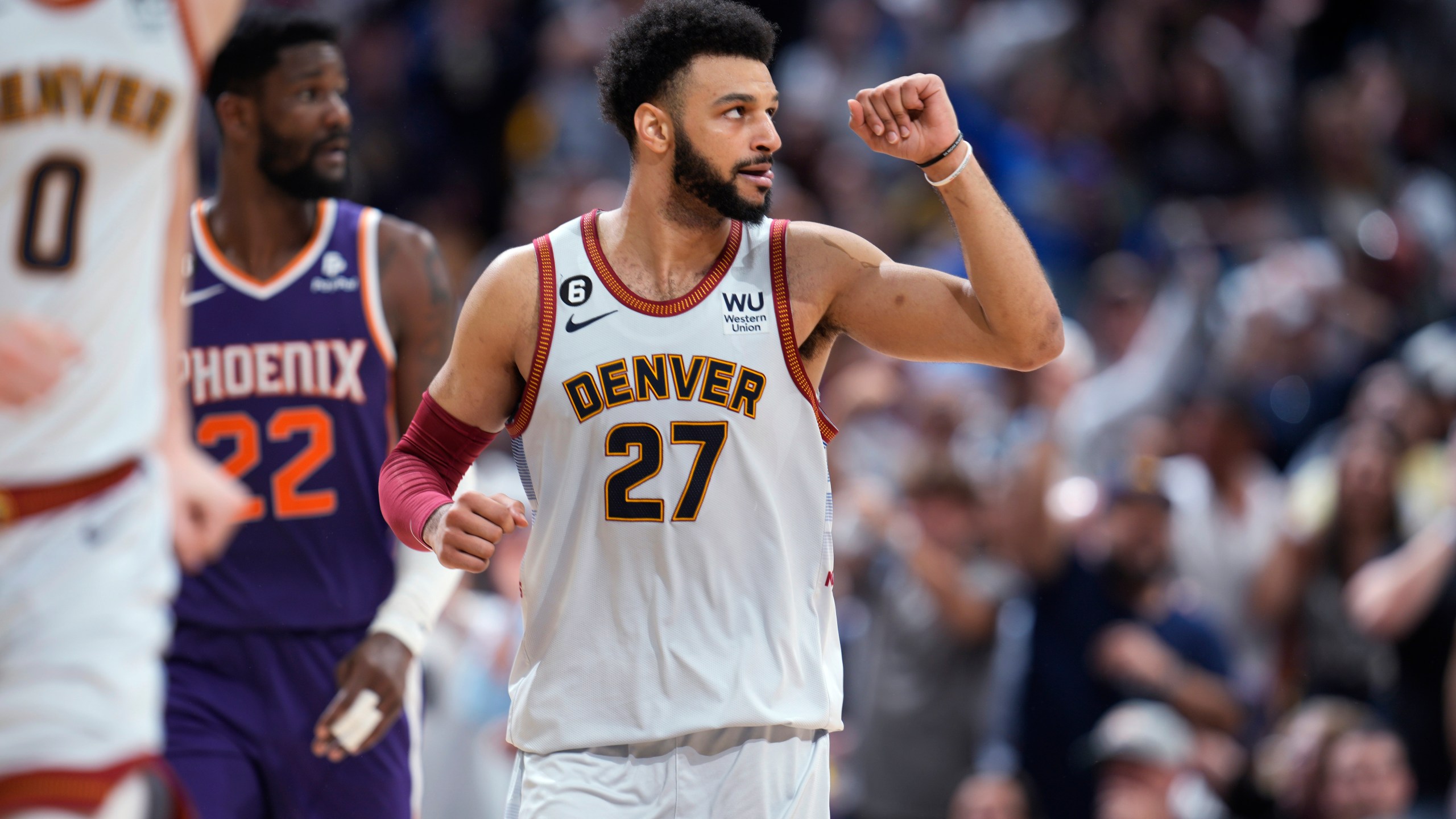 Denver Nuggets guard Jamal Murray gestures after hitting a 3-point basket against the Phoenix Suns during the second half of Game 5 of an NBA Western Conference basketball semifinal playoff series Tuesday, May 9, 2023, in Denver. (AP Photo/David Zalubowski)