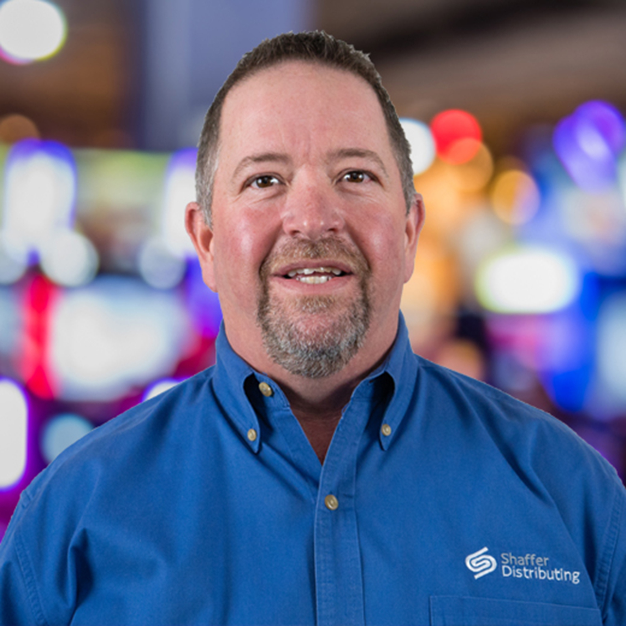 This photo provided by Shaffer Distributing in May 2023, shows Marty Turner, director of vending sales for the company. Vending machines that have long been stocked with snacks are getting repurposed to distribute life-saving supplies to help fight the opioid epidemic. A growing number of cities and local governments are making so-called “harm reduction” items, including the overdose-reversal drug naloxone, available for free via machines. (Shaffer Distributing via AP)