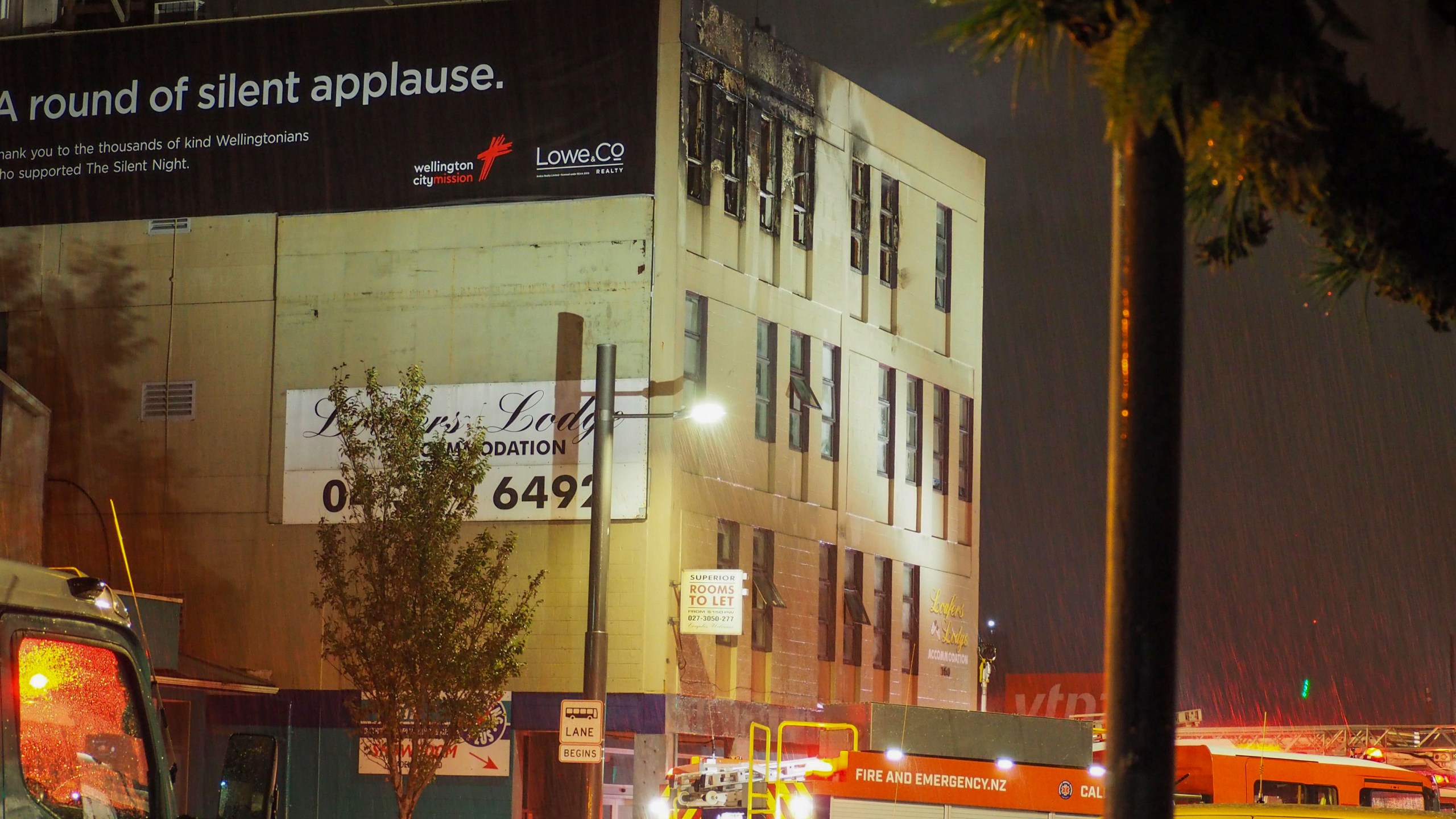 Firetrucks stage outside a fire at a hostel in central Wellington, New Zealand, Tuesday, May 16, 2023. Several people were killed after a fire broke out overnight at the four-story building. (Nick James/NZ Herald via AP)