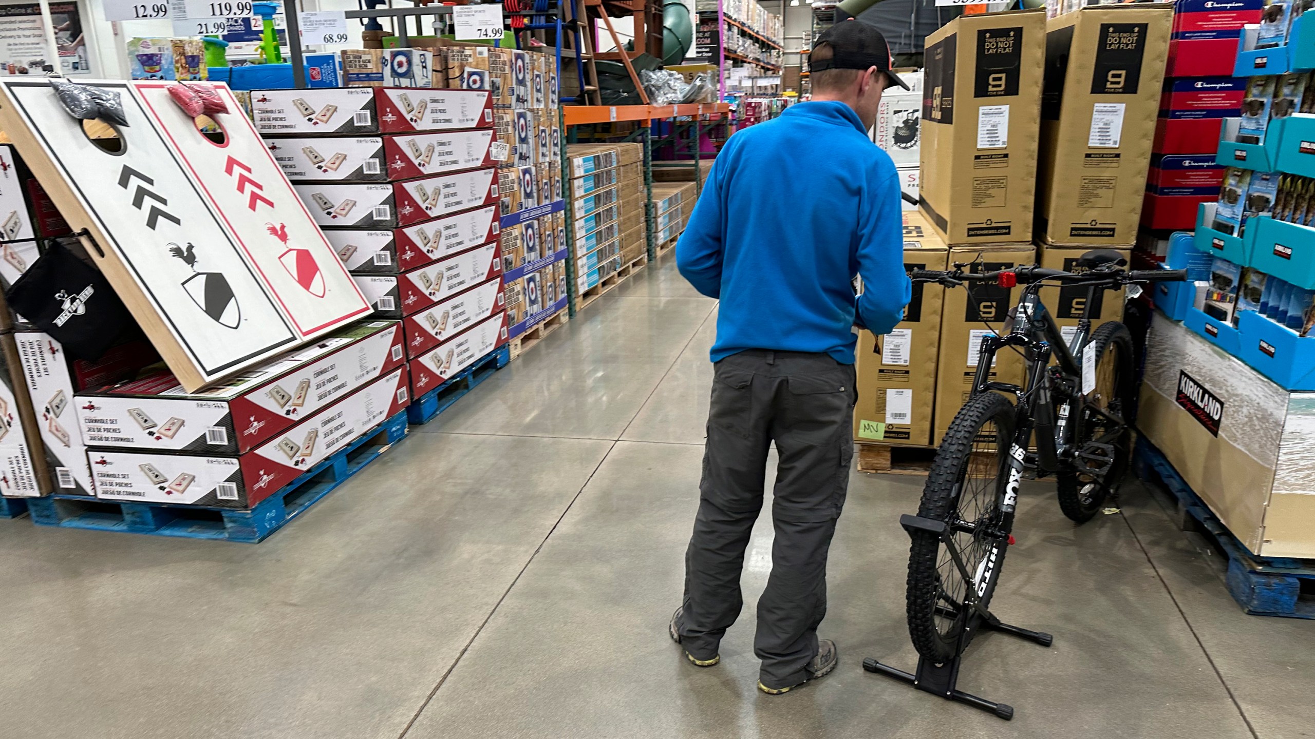 A shopper peruses a mountain bicycle on display in a Costco warehouse Wednesday, May 10, 2023, in Sheridan, Colo. On Tuesday, the Commerce Department releases U.S. retail sales data for April. (AP Photo/David Zalubowski)