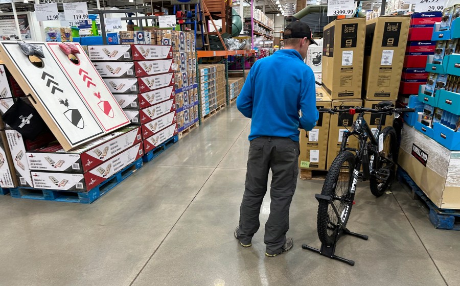 A shopper peruses a mountain bicycle on display in a Costco warehouse Wednesday, May 10, 2023, in Sheridan, Colo. On Tuesday, the Commerce Department releases U.S. retail sales data for April. (AP Photo/David Zalubowski)