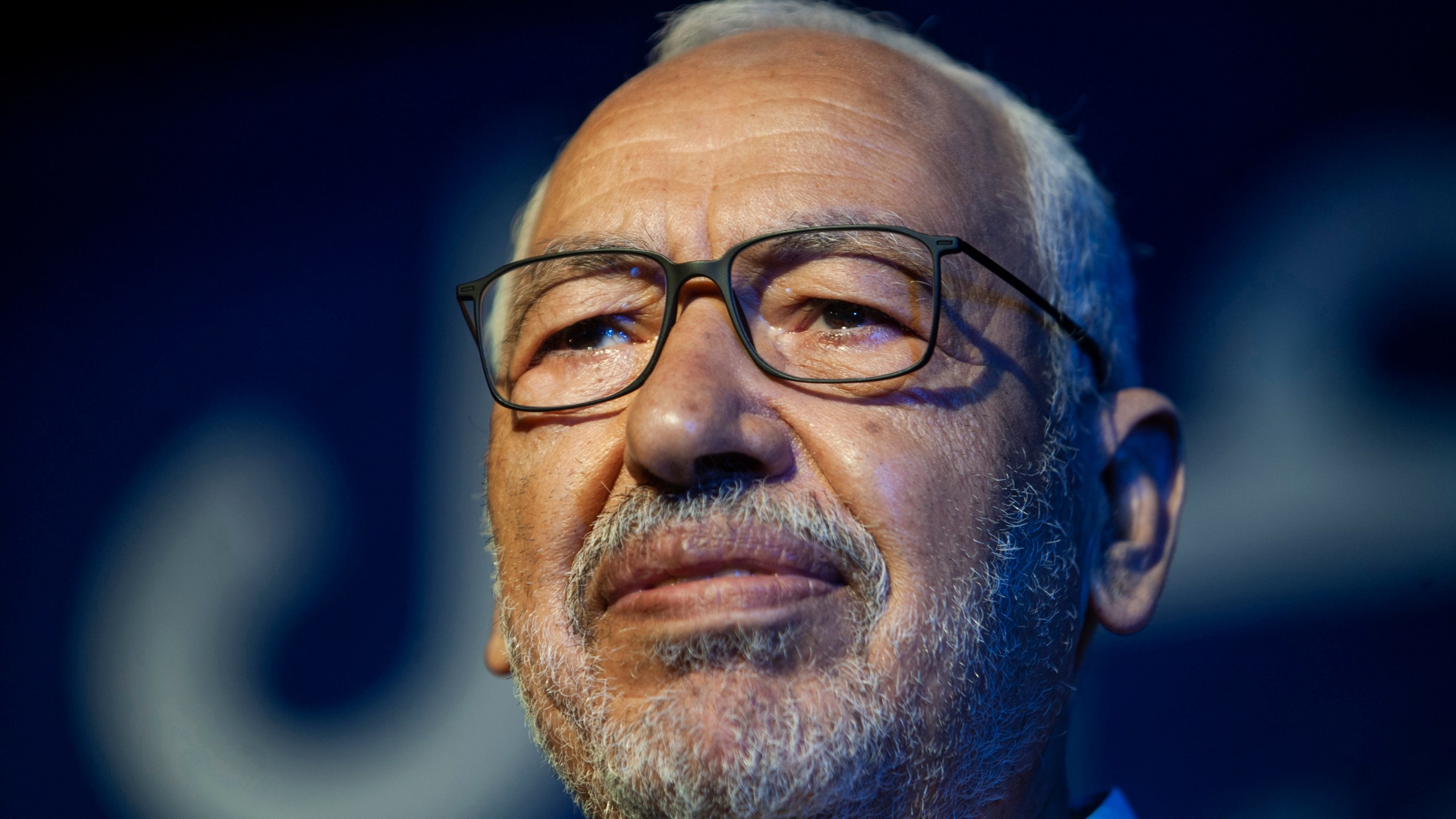 FILE - Islamist party leader and then parliament speaker Rached Ghannouchi speaks during a meeting in Tunis, onOct. 3, 2019. A court has sentenced moderate Tunisian Islamist leader Rached Ghannouchi to a year in prison for allegedly referring to police officers as tyrants in what his party said early Tuesday May 16, 2023 amounted to a sham trial. (AP Photo/Hassene Dridi, File)