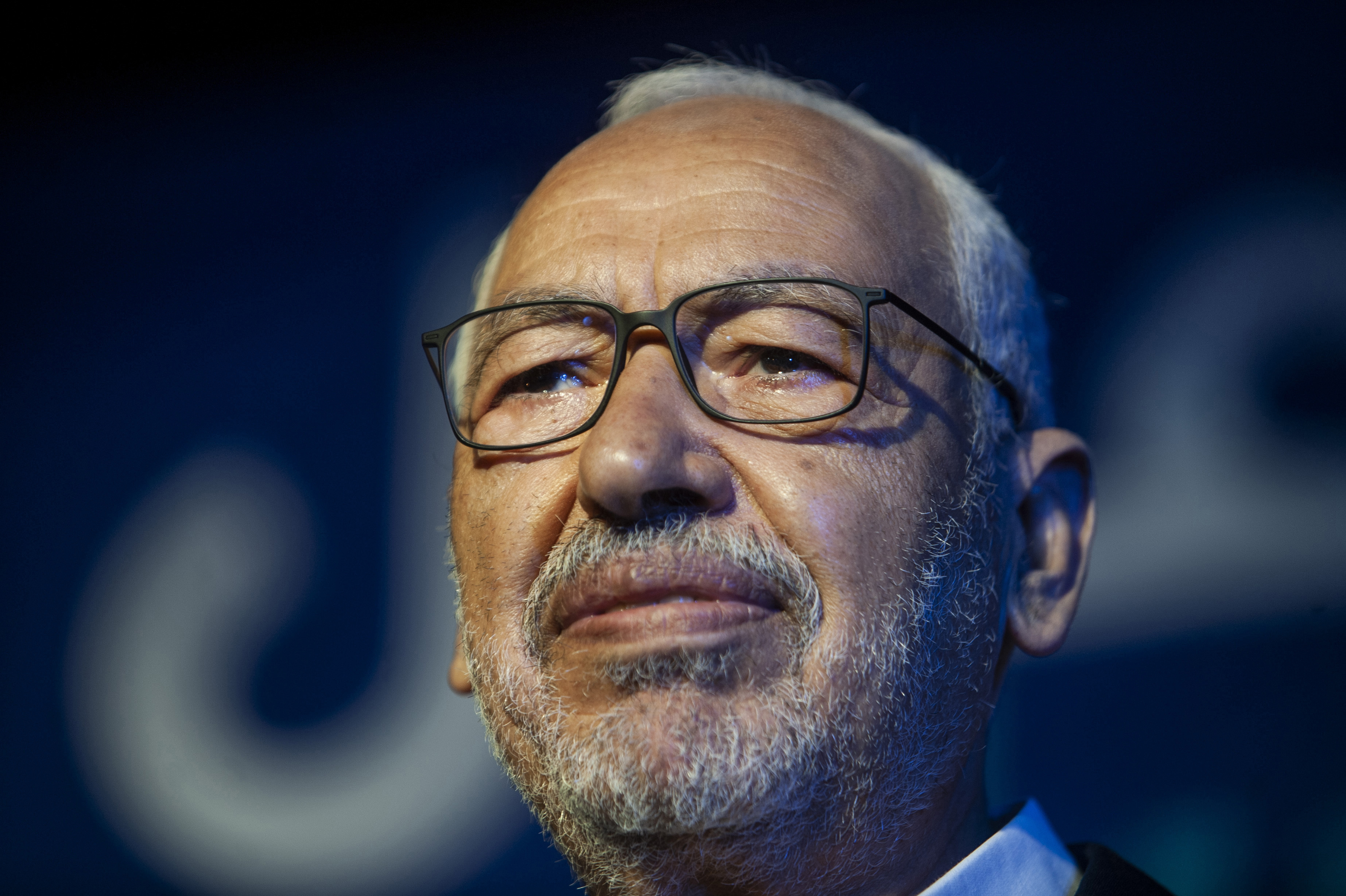 FILE - Islamist party leader and then parliament speaker Rached Ghannouchi speaks during a meeting in Tunis, onOct. 3, 2019. A court has sentenced moderate Tunisian Islamist leader Rached Ghannouchi to a year in prison for allegedly referring to police officers as tyrants in what his party said early Tuesday May 16, 2023 amounted to a sham trial. (AP Photo/Hassene Dridi, File)