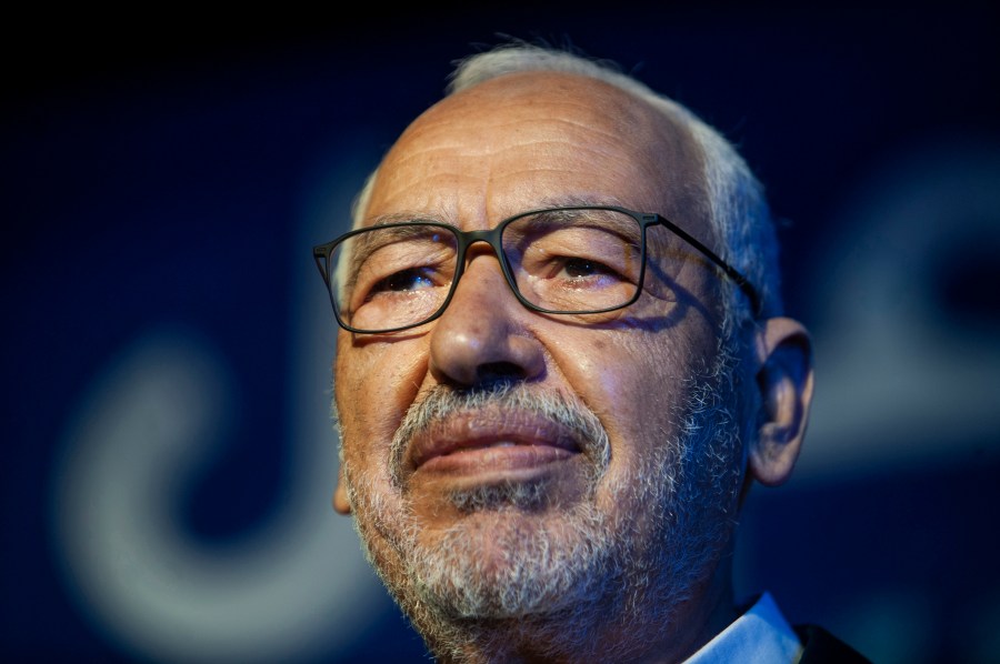 FILE - Islamist party leader and then parliament speaker Rached Ghannouchi speaks during a meeting in Tunis, onOct. 3, 2019. A court has sentenced moderate Tunisian Islamist leader Rached Ghannouchi to a year in prison for allegedly referring to police officers as tyrants in what his party said early Tuesday May 16, 2023 amounted to a sham trial. (AP Photo/Hassene Dridi, File)