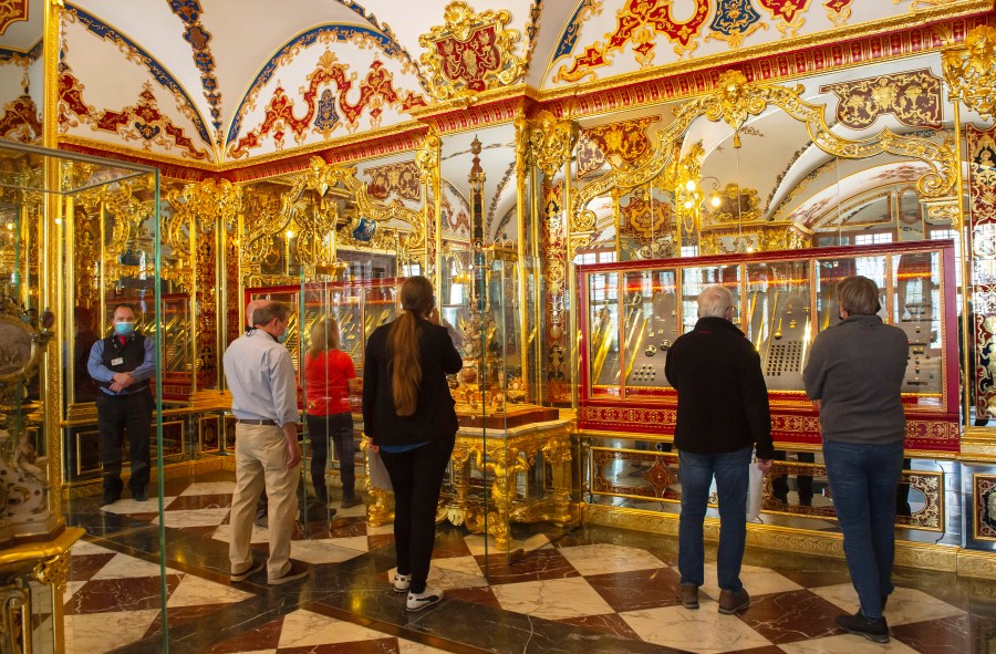 FILE - Visitors stand in the Jewel Room during the reopening of the Green Vault Museum in Dresden's Royal Palace of the Dresden State Art Collections (SKD) in Dresden, Germany, May 30, 2020. A German court on Tuesday May 16, 2023, convicted five men of particularly aggravated arson in combination with dangerous bodily injury, theft with weapons, damage to property and intentional arson in the spectacular theft of 18th-century jewels from the Dresden museum in 2019. (AP Photo/Jens Meyer, file)