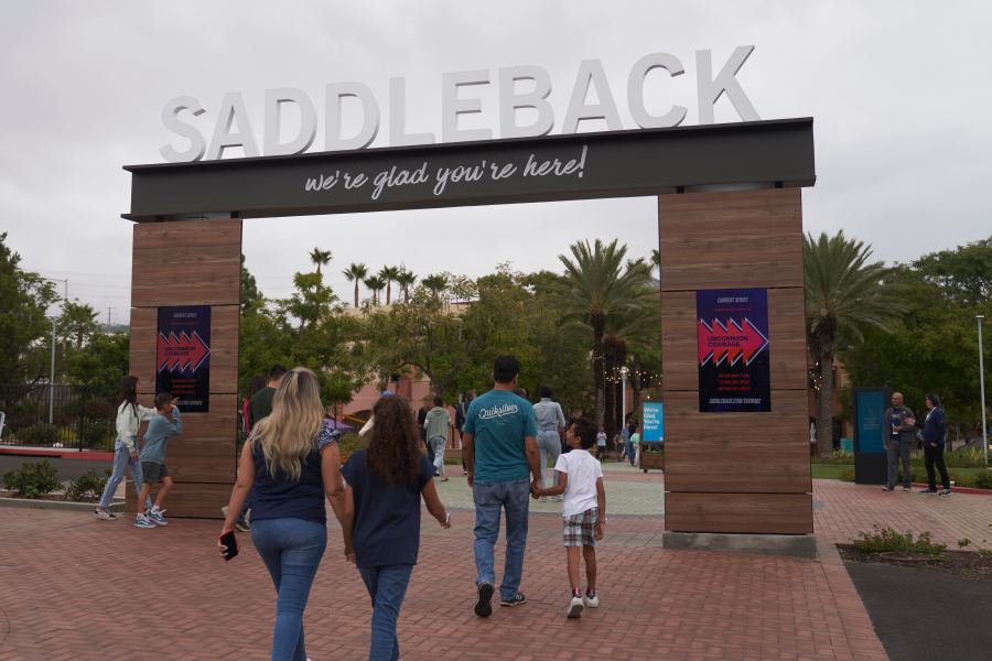 FILE - Congregants arrive at Saddleback Church in Lake Forest, Calif., on Sunday, Oct. 16, 2022. Saddleback Church is appealing its ouster from the Southern Baptist Convention for having women pastors on staff, according to the denomination. The Executive Committee of the nation’s largest Protestant denomination had voted to expel the church earlier this year. But the Southern California megachurch is exercising its right to appeal to the full annual meeting of the convention next month in New Orleans. Southern Baptists’ statement of faith says the office of pastor is limited to men. (AP Photo/Allison Dinner, File)