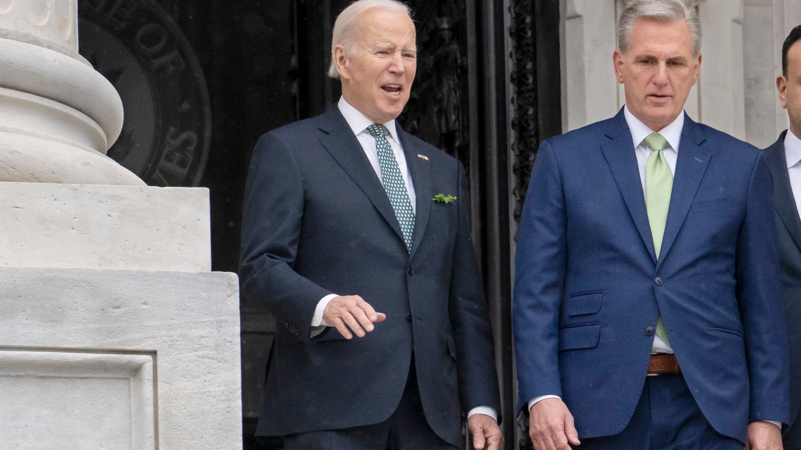 FILE - President Joe Biden talks with House Speaker Kevin McCarthy, R-Calif., as he departs the Capitol following the annual St. Patrick's Day gathering, in Washington, March 17, 2023. Facing the risk of a federal government default as soon as June 1, President Joe Biden has invited the top four congressional leaders to a White House meeting on May 9 for talks. It’s the first concrete step toward negotiations on averting a potential economic catastrophe, but there’s a long way to go: Biden and Republicans can’t even agree on what’s up for negotiation. (AP Photo/J. Scott Applewhite, File)