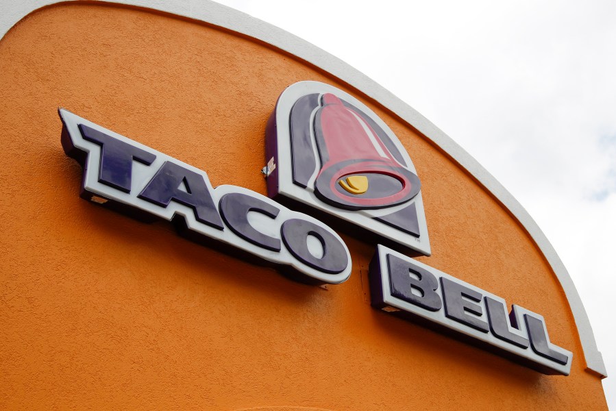 FILE - A sign hangs at a Taco Bell on May 23, 2014, in Mount Lebanon, Pa. Declaring a mission to liberate "Taco Tuesday" for all, Taco Bell asked U.S. regulators Tuesday, May 16, 2023, to force Wyoming-based Taco John's to abandon its longstanding claim to the trademark. (AP Photo/Gene J. Puskar, File)