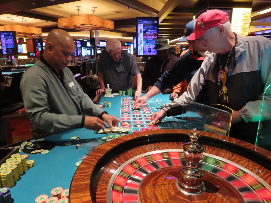 A dealer conducts a game of roulette at the Tropicana casino in Atlantic City, N.J., on May 12, 2022. New Jersey's casinos, racetracks that accept sports bets and their online partners won $462.7 million in April, an increase of 9.5% from a year earlier. That figure includes winnings from internet and sports betting operations. But the amount won on-premises by physical casinos fell by 1.6% to $231.4 million. (AP Photo/Wayne Parry)