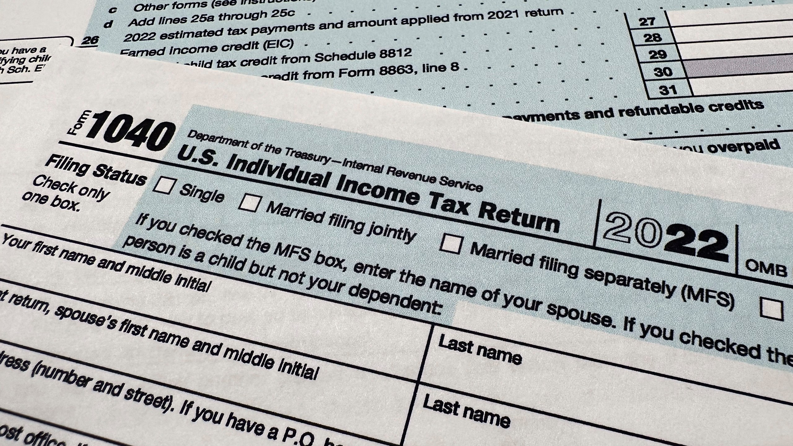 FILE - The Internal Revenue Service 1040 tax form for 2022 is seen on April 17, 2023. The IRS is planning to launch a pilot program for a government-run, online tax filing system that’s free for all. After months of research, the IRS published a feasibility report on Tuesday, May 16, 2023, laying out taxpayer interest in direct file, how the system could work, its potential cost, operational challenges and more. (AP Photo/Jon Elswick, File)