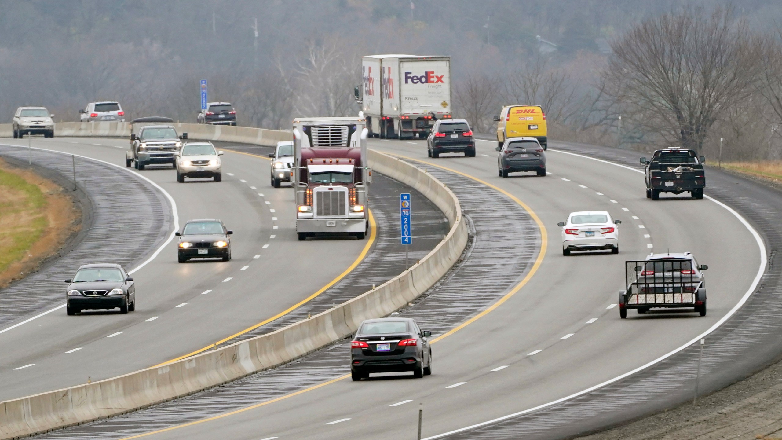 Vehicles travel in advance of Thanksgiving along I-70 near Lawrence, Kan., Wednesday, Nov. 25, 2020.