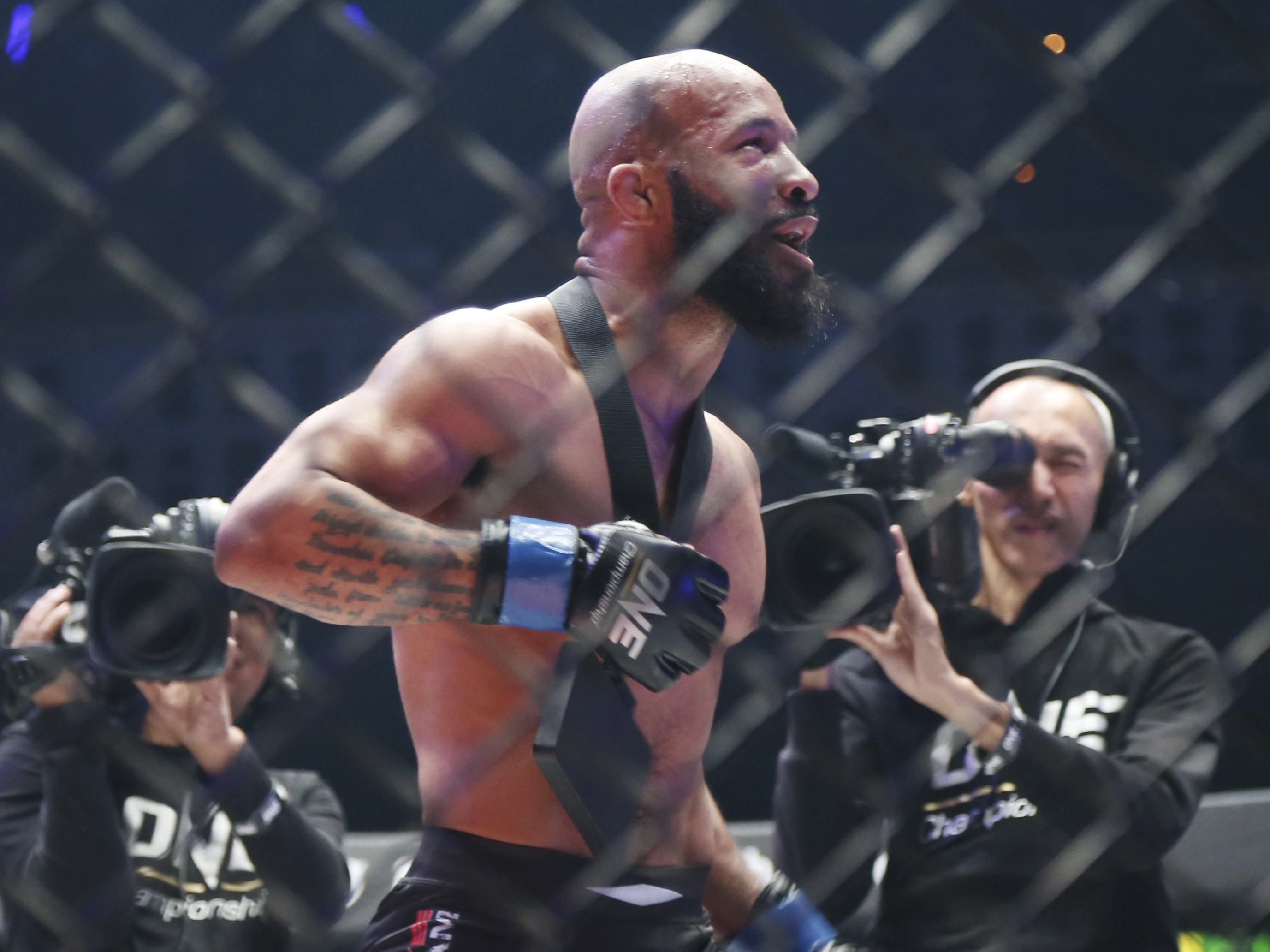 Mixed Martial Arts fighter Demetrious Johnson celebrates after defeating Japan's Yuya Wakamatsu in a flyweight world grand prix quarterfinal One Championship bout in Tokyo