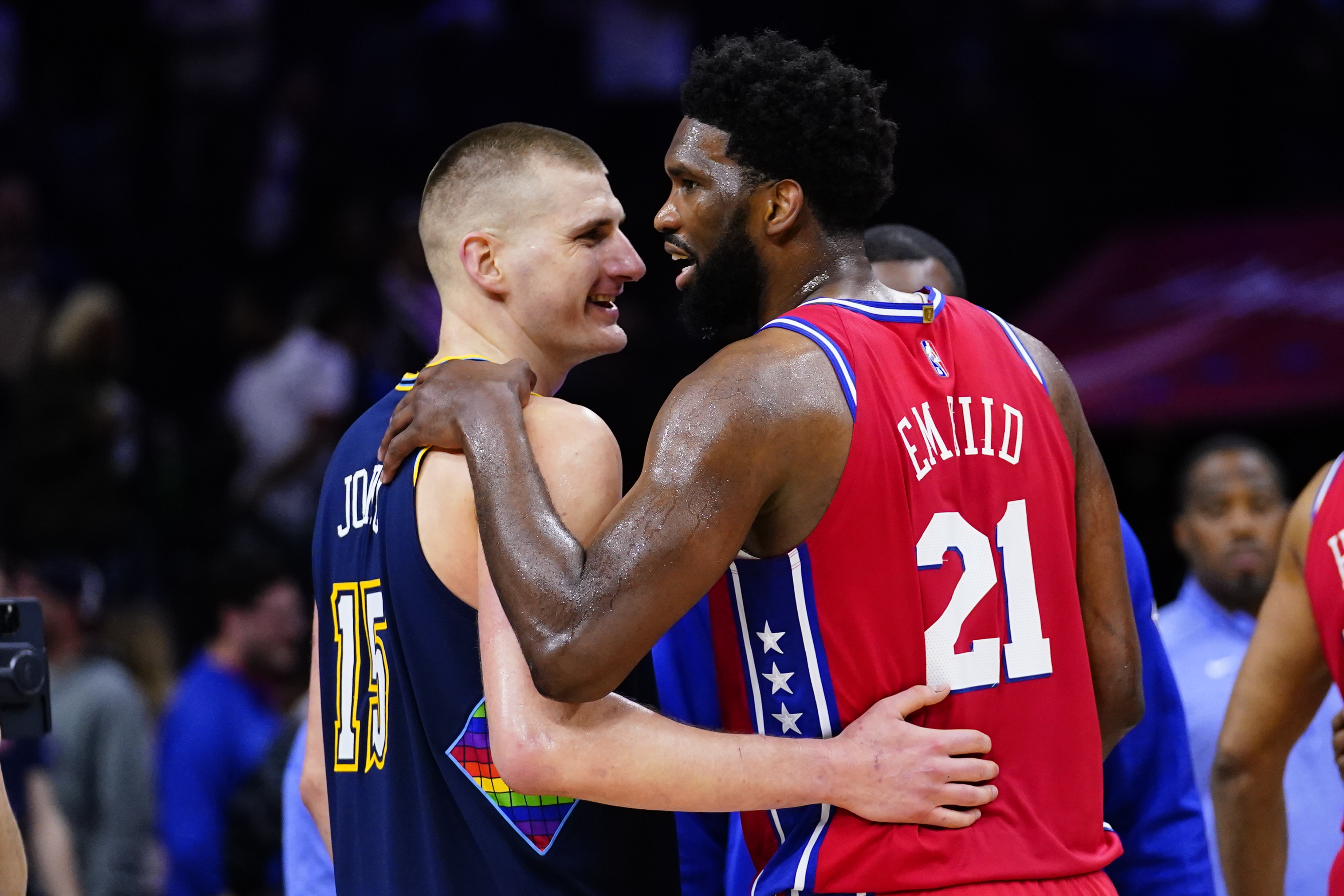 Denver Nuggets' Nikola Jokic and Philadelphia 76ers' Joel Embiid meet on the court after an NBA basketball game