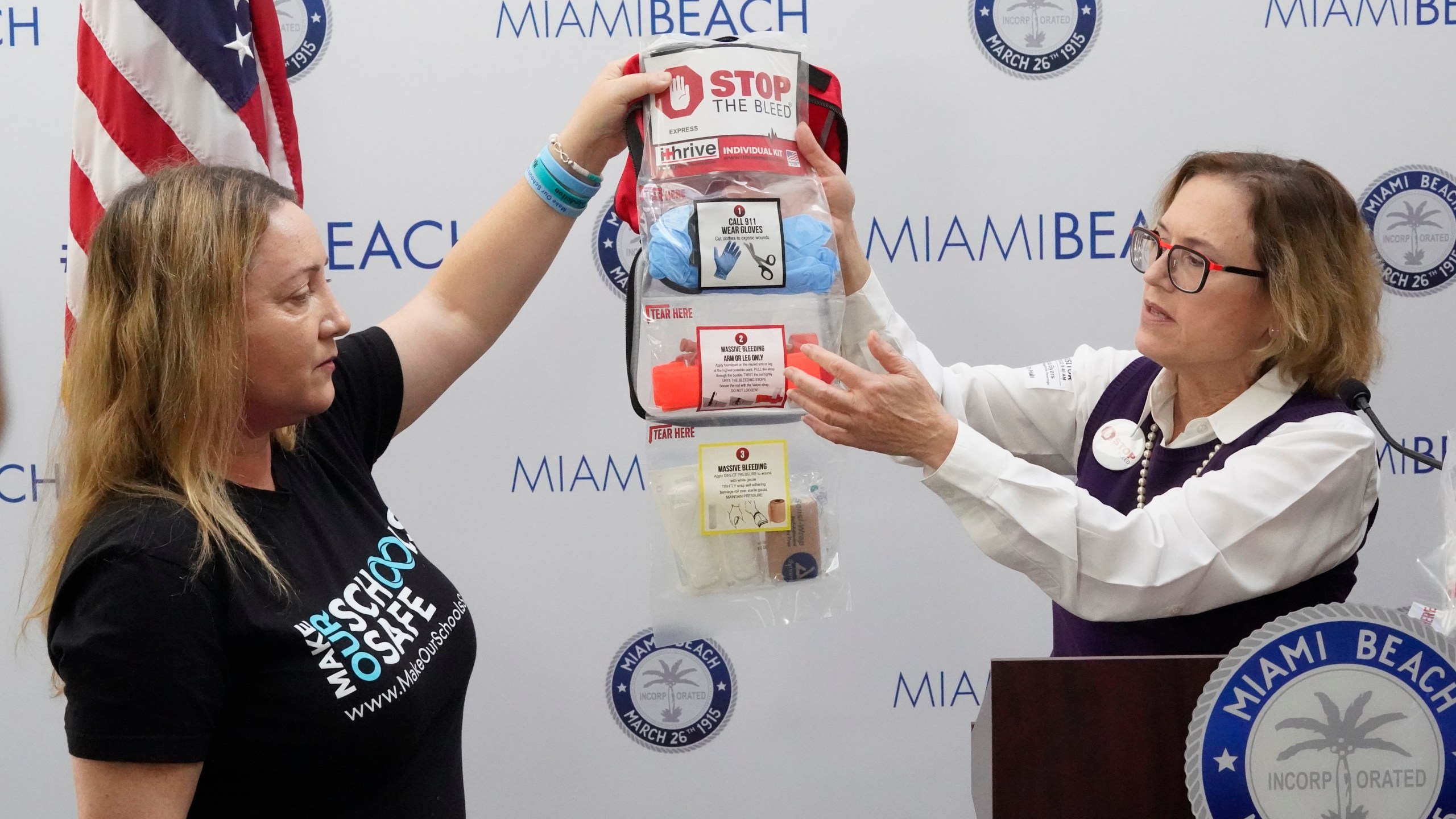 Lori Alhadeff, left, and Dr. Patricia Byers, a surgical critical care and trauma surgeon, point out the contents of a Stop the Bleed kit during a news conference