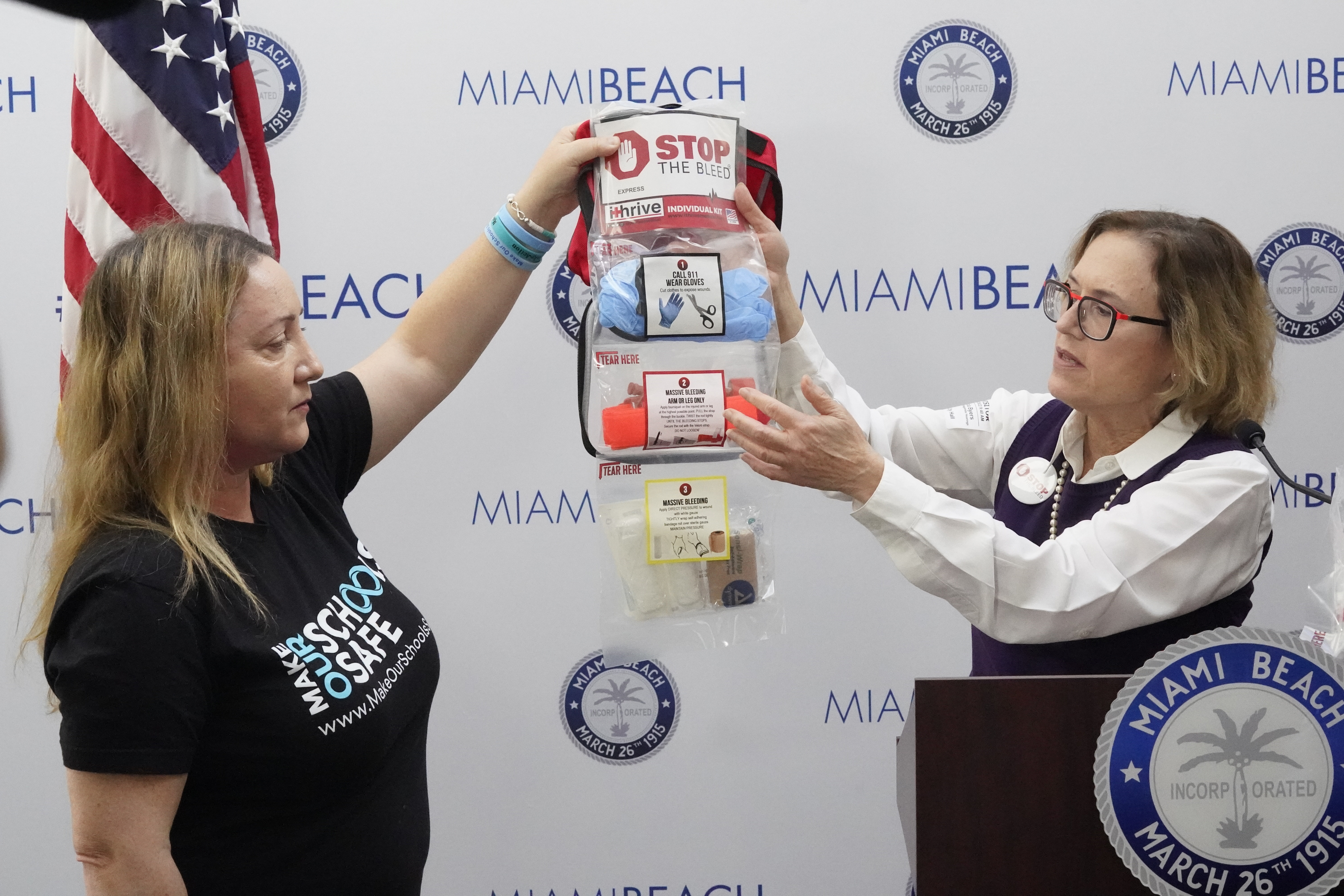 Lori Alhadeff, left, and Dr. Patricia Byers, a surgical critical care and trauma surgeon, point out the contents of a Stop the Bleed kit during a news conference