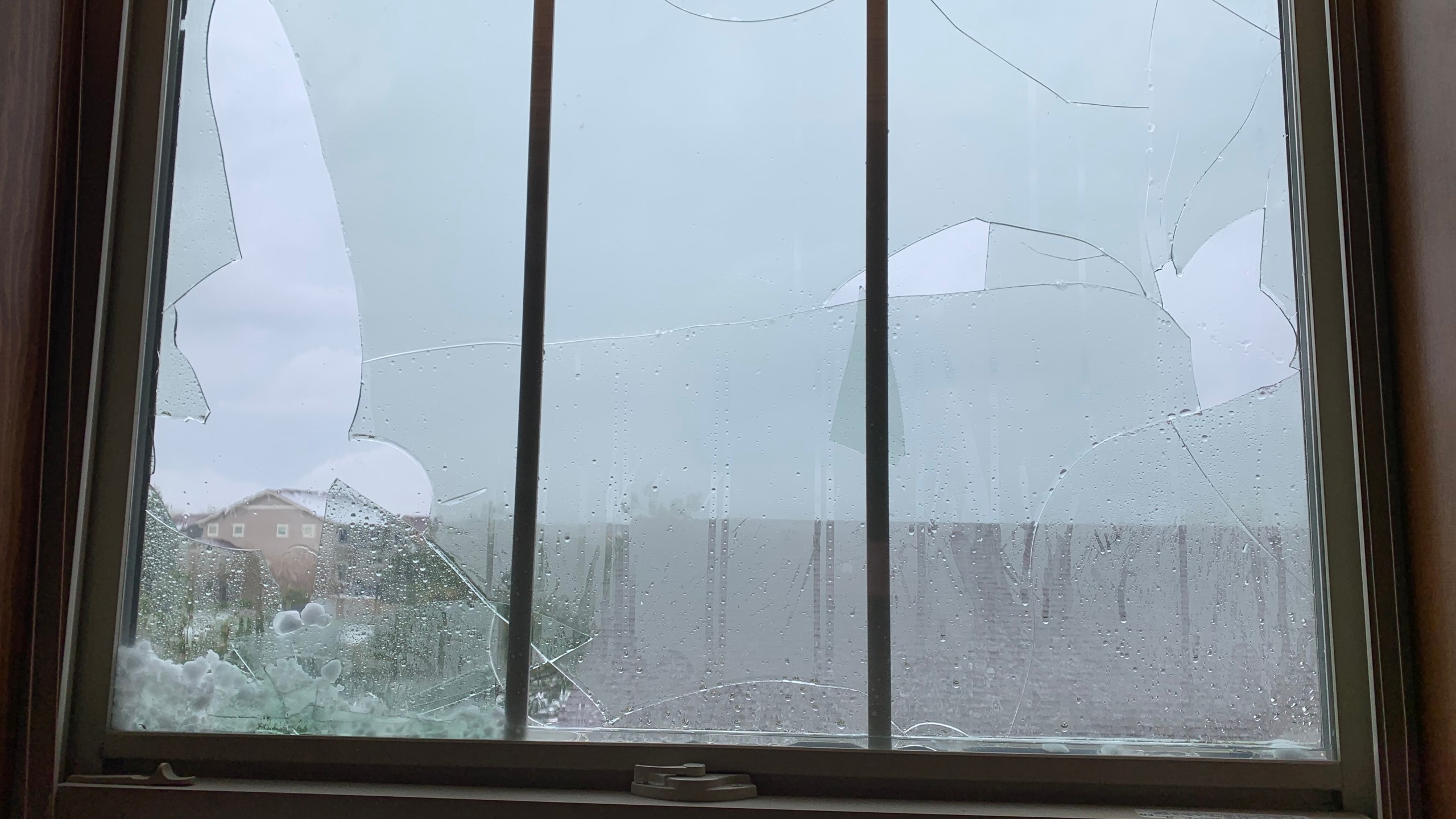 Shattered windows from hail in Castle Rock