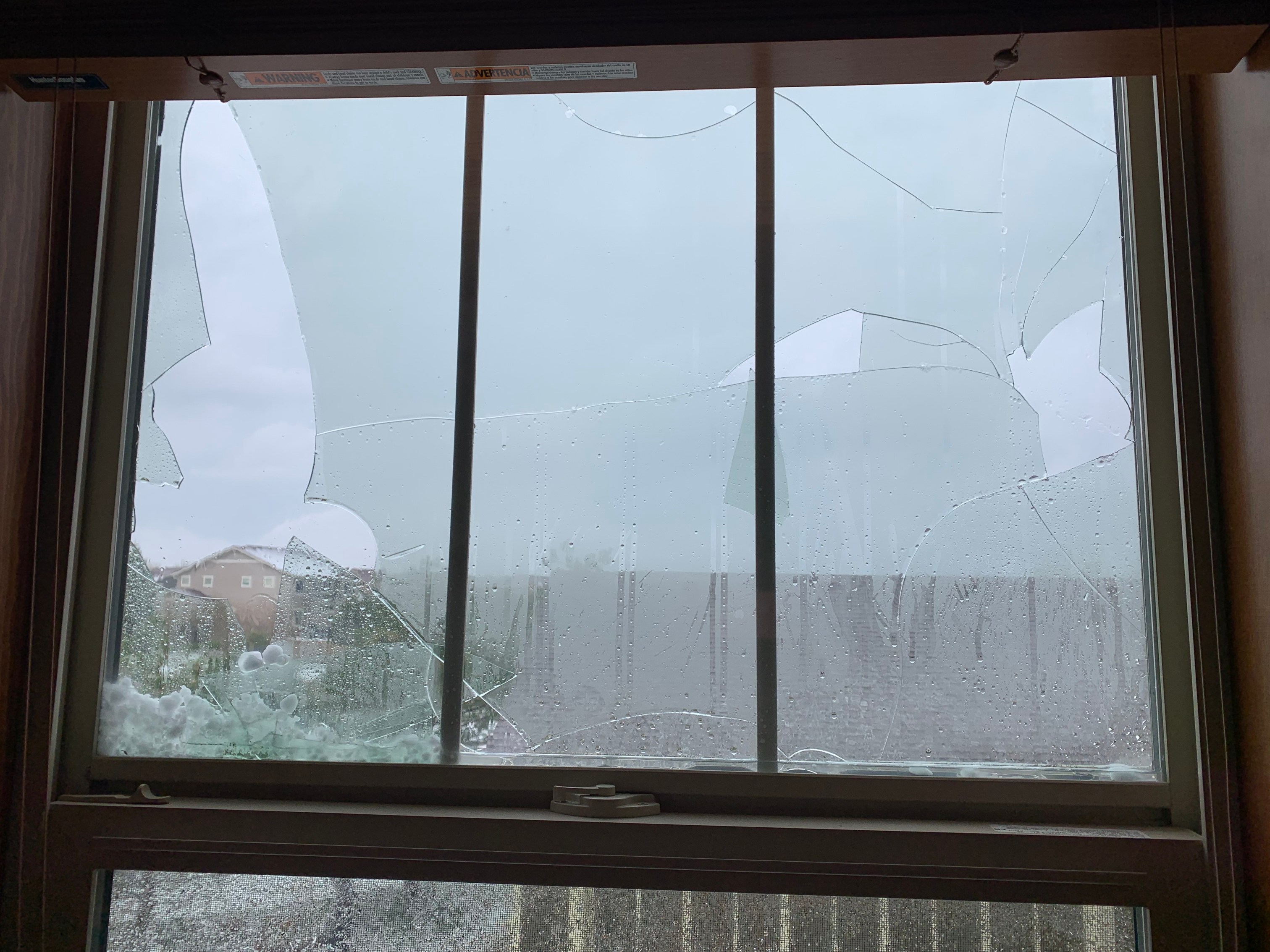 Shattered windows from hail in Castle Rock