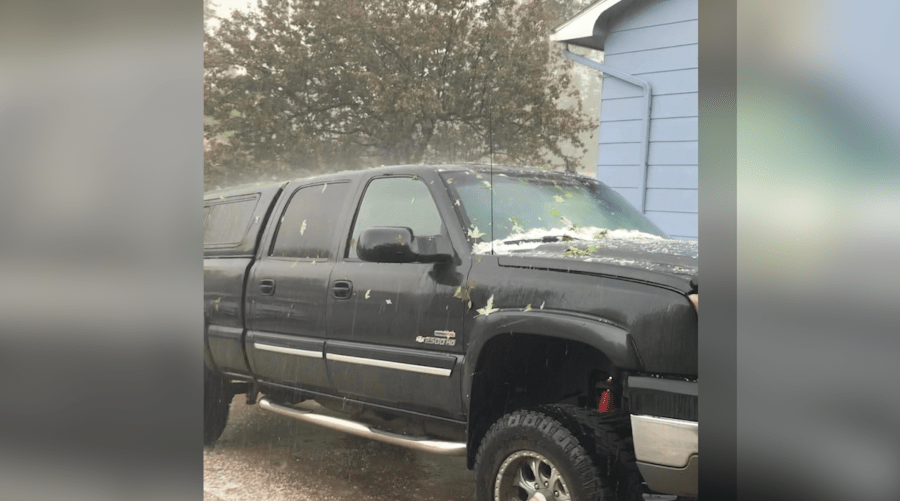 Black 2005 Chevrolet Silverado with a bed cover